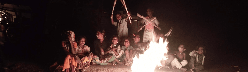 Community gathering around fire